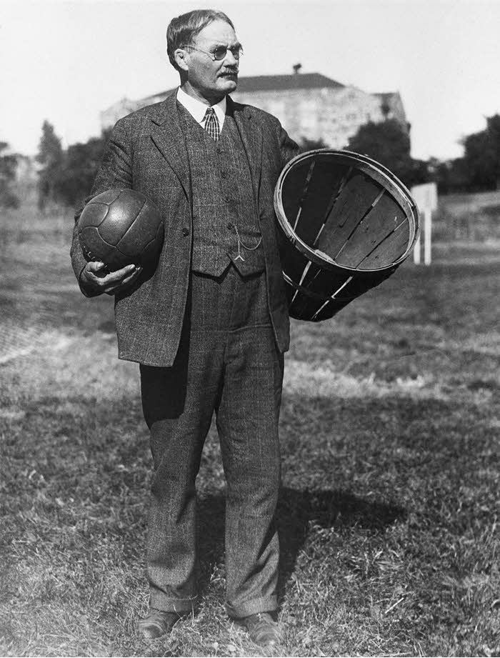 James Naismith with the original basket and ball