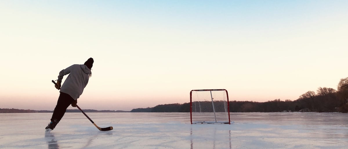 Playing hockey at sunset