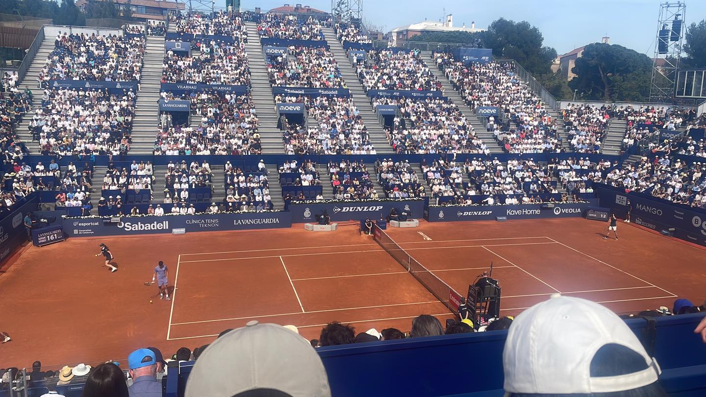 Professional tennis tournament with packed stadium showing the scale of elite events
