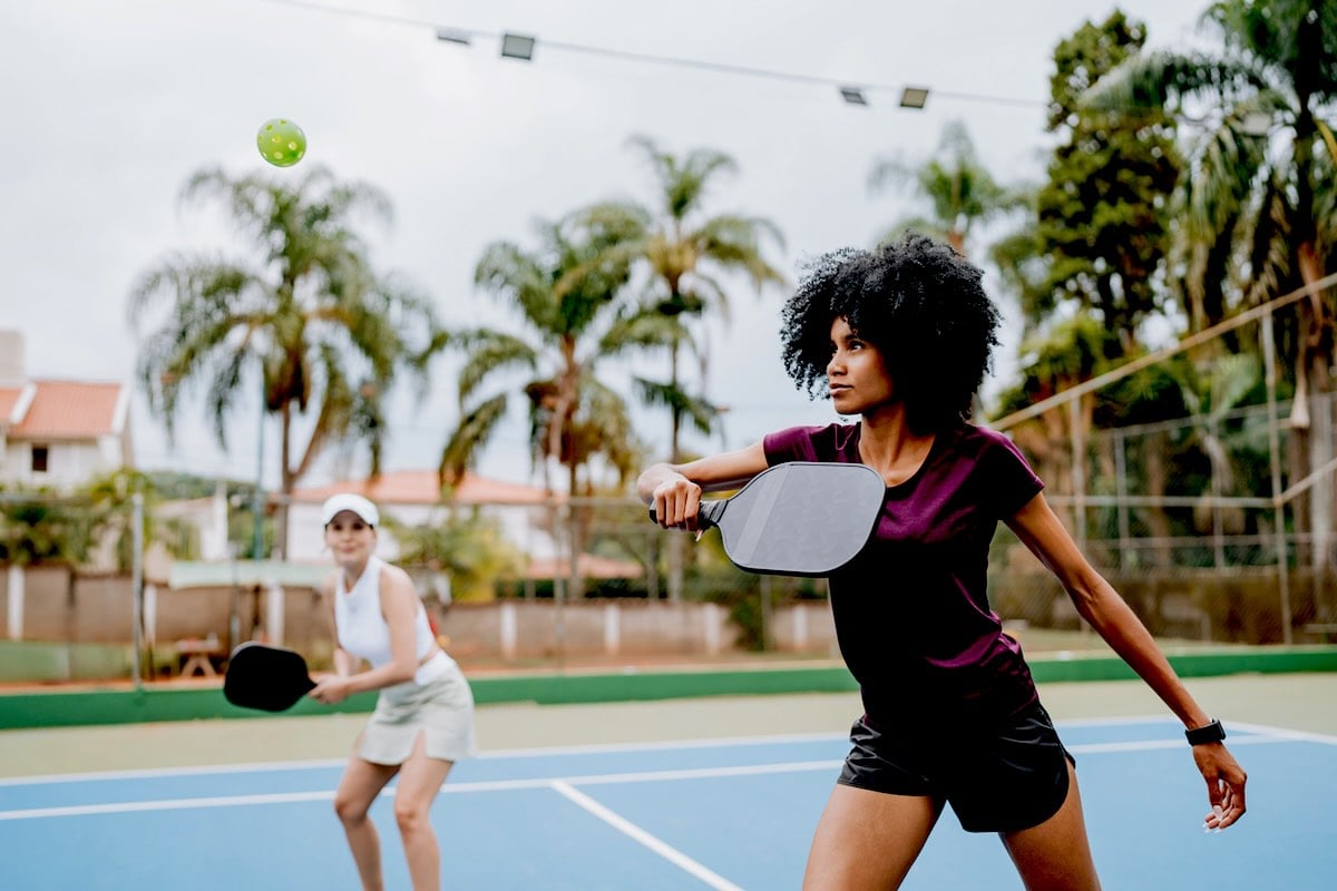 4 people playing a game of Pickleball