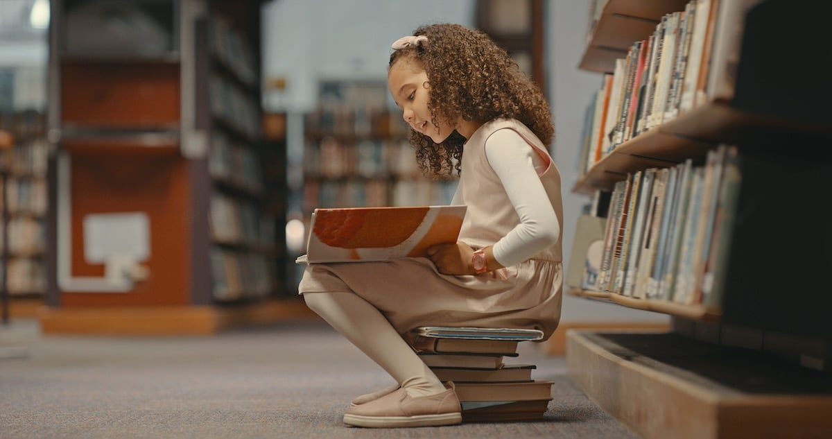 A girl reading in the library