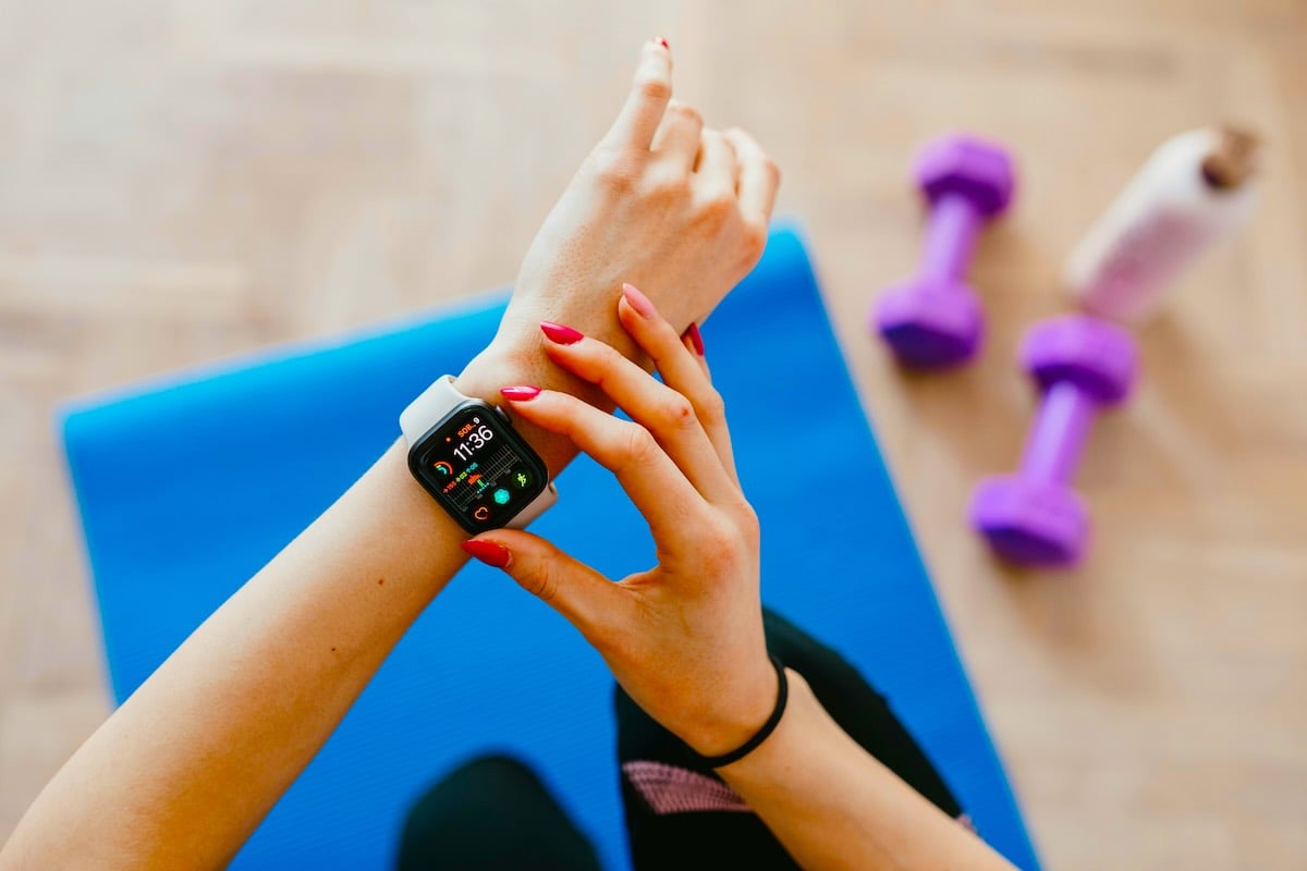 A woman counting steps on her Apple Watch