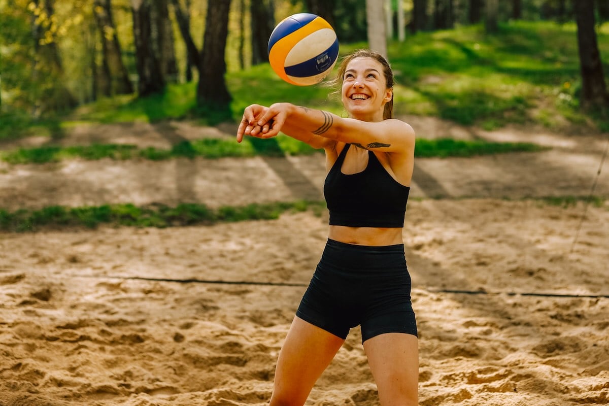 A woman playing volleyball