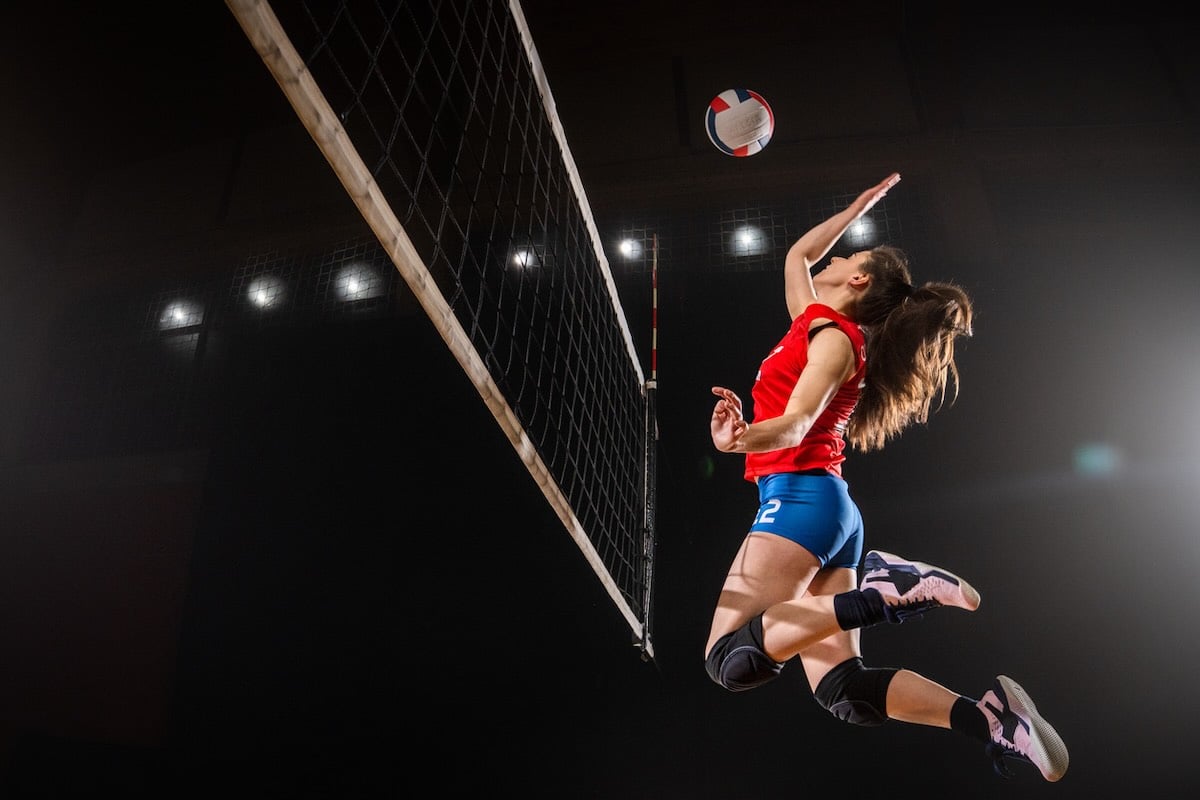 Woman spiking a volleyball