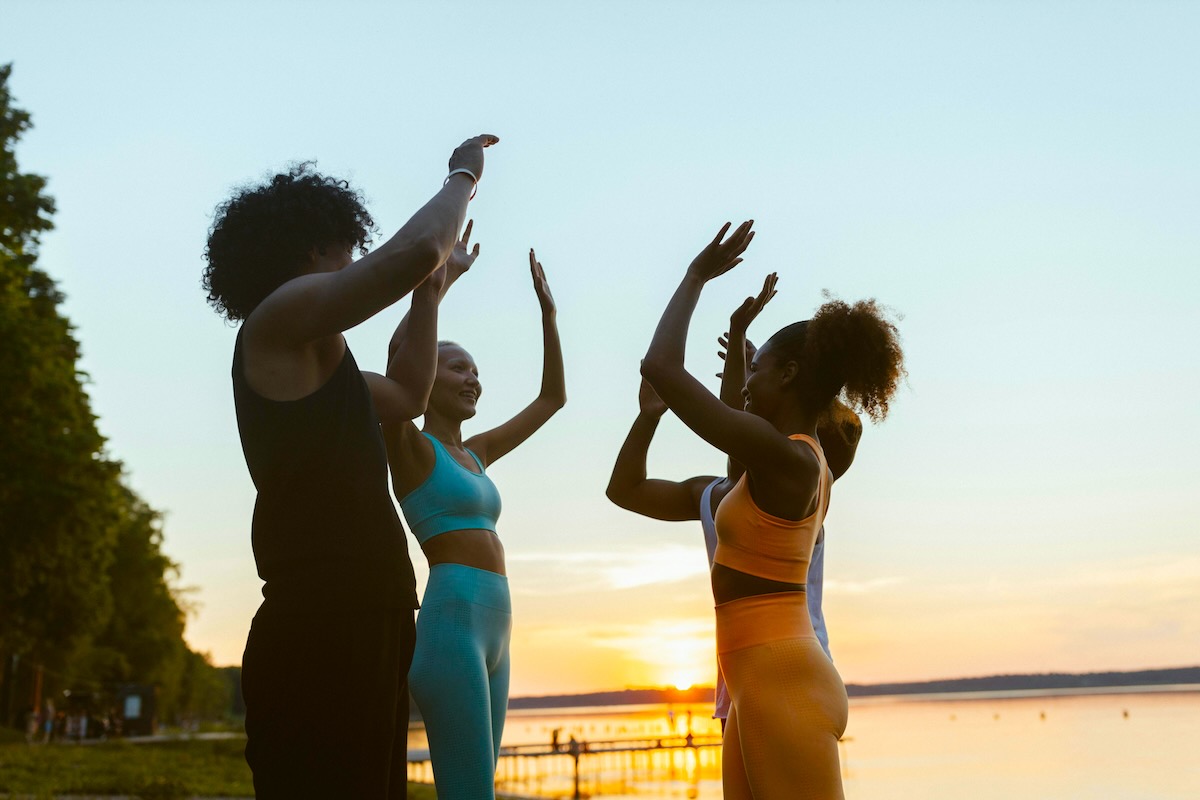 Women high fiving