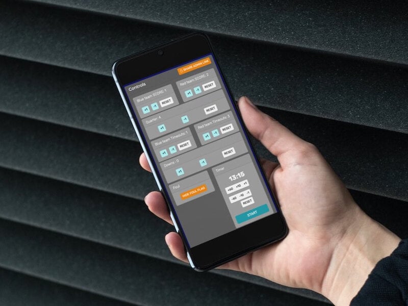 A mobile phone that is controlling a volleyball scoreboard